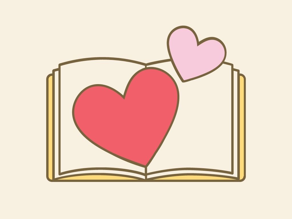 Dwa różowe serca na rozłożonej książce.